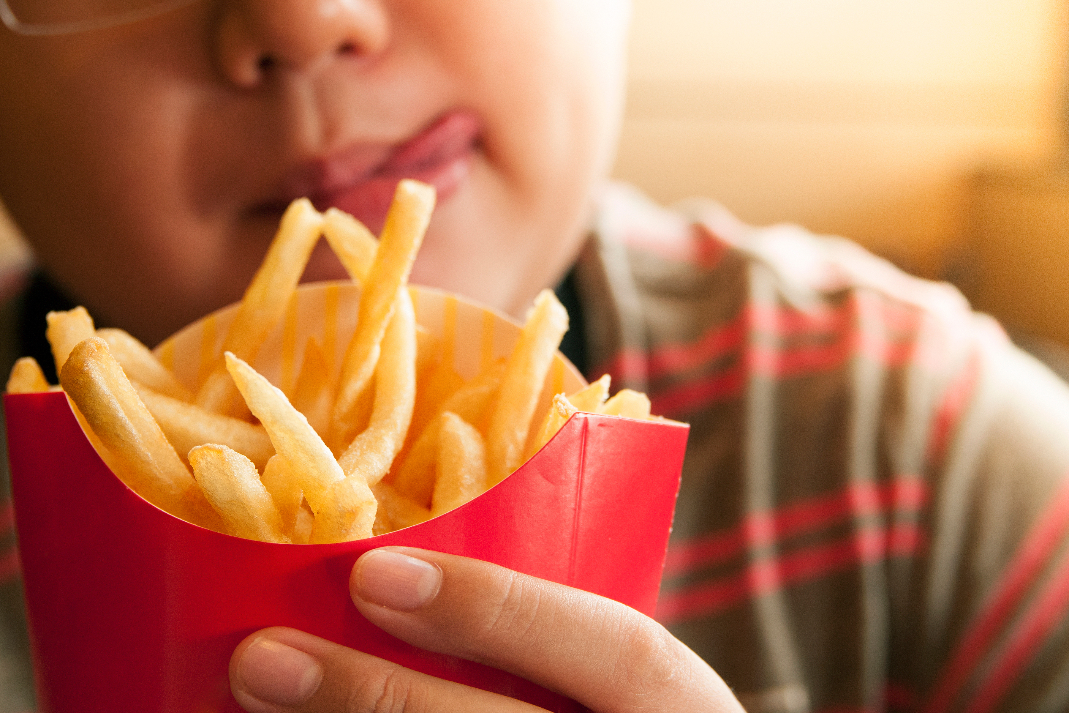 kid eating french fries