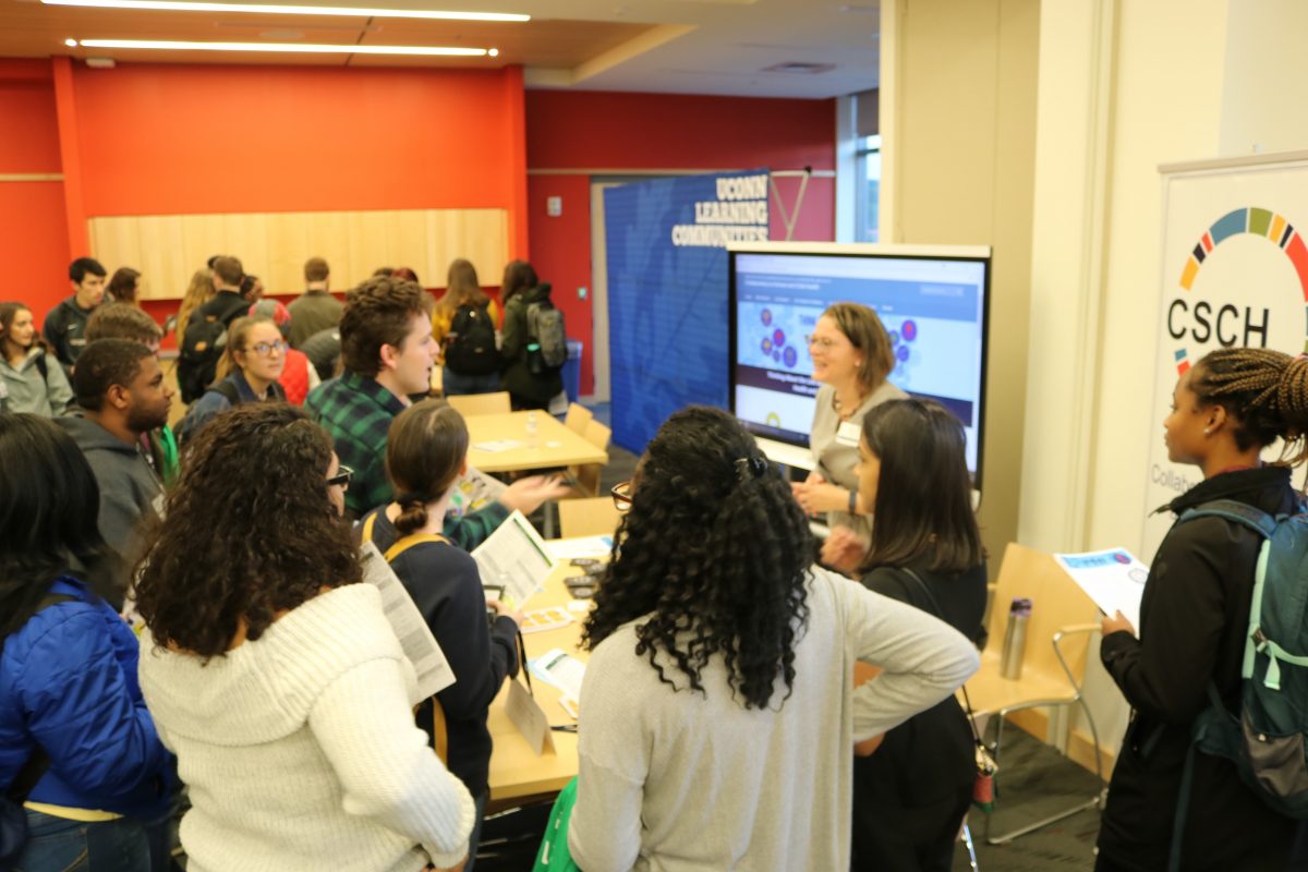 CSCH Booth at Research Connections event surrounded by students