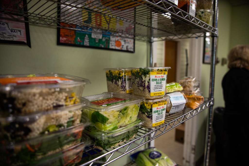 packaged salads on food pantry shelf