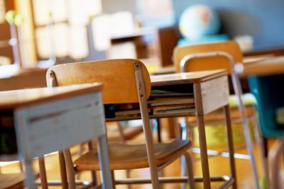 empty classroom with desks and chairs