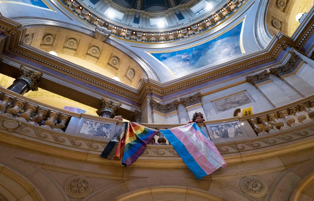 Activists rally before the Minnesota senate in the state capitol in St Paul, on 21 April. Photograph: Stephen Maturen/AFP/Getty Images)