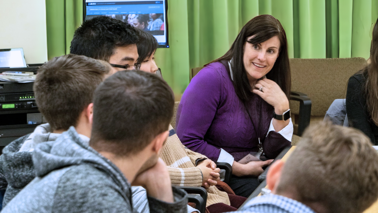 professor chats with students