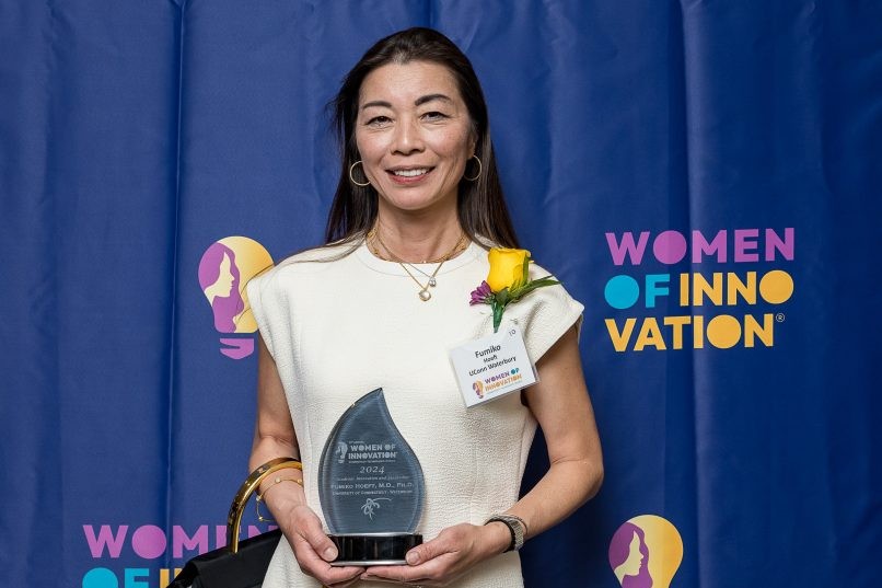 Dean Fumiko Hoeft receives an award 